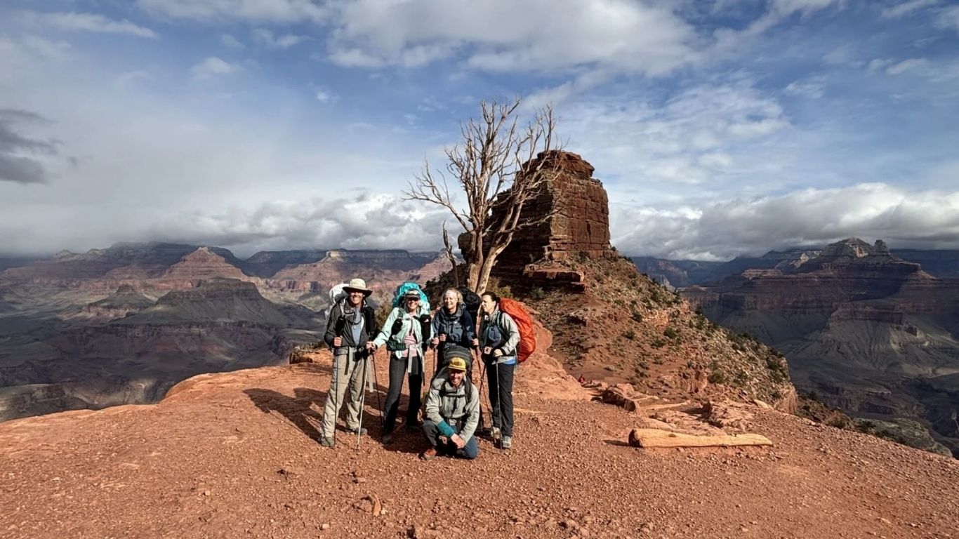 Hikers exploring a trail below the Grand Canyon South Rim in Arizona