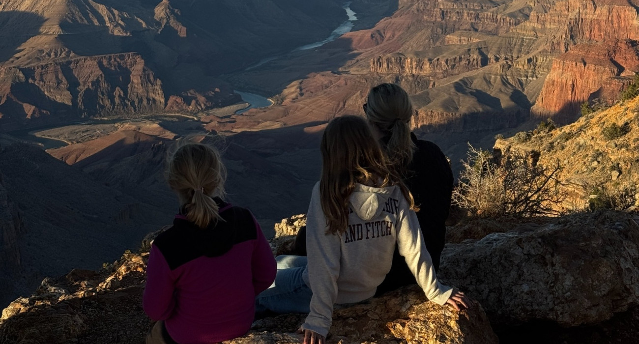 Visitors overlooking the Grand Canyon South Rim in Arizona